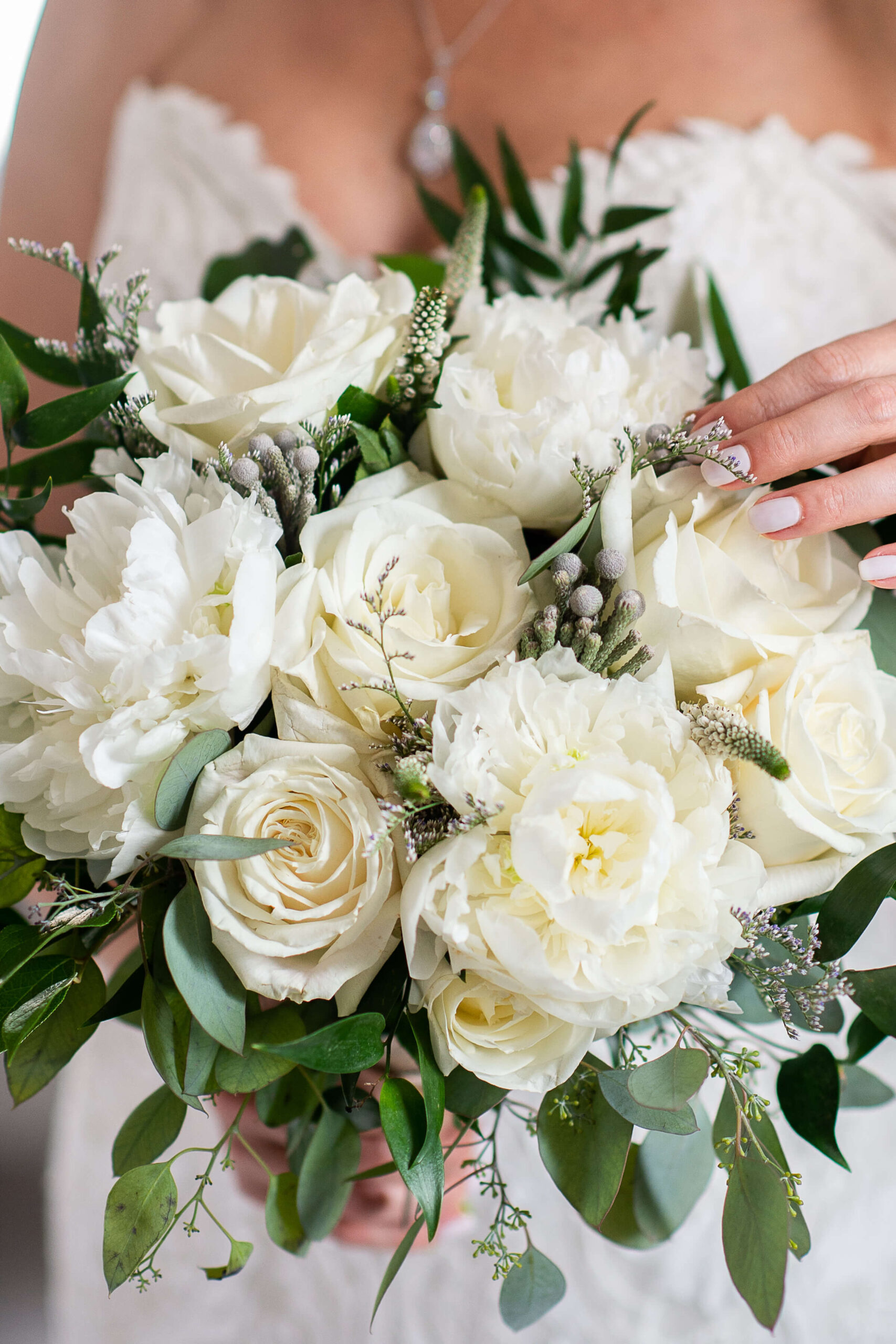 closeup photo of a white bridal bouquet