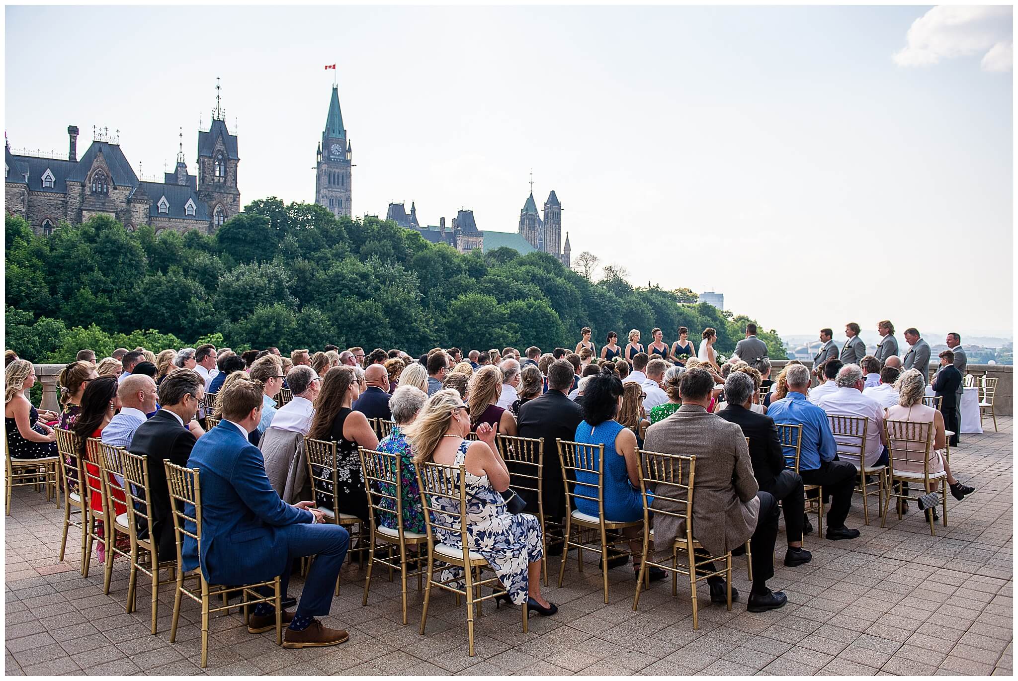 outdoor ceremony site on the terrace of Chateau Laurier weddings with Parliament in the background