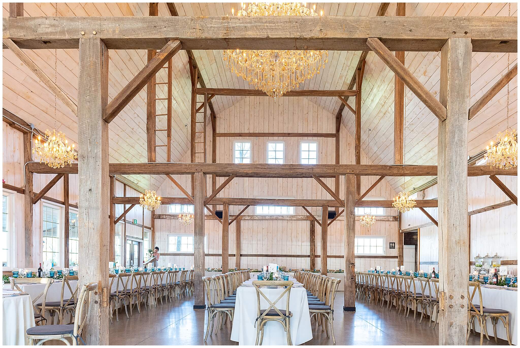 a wide angle picture of the Stonefields Estate Loft showing the high ceilings, beams and chandeliers