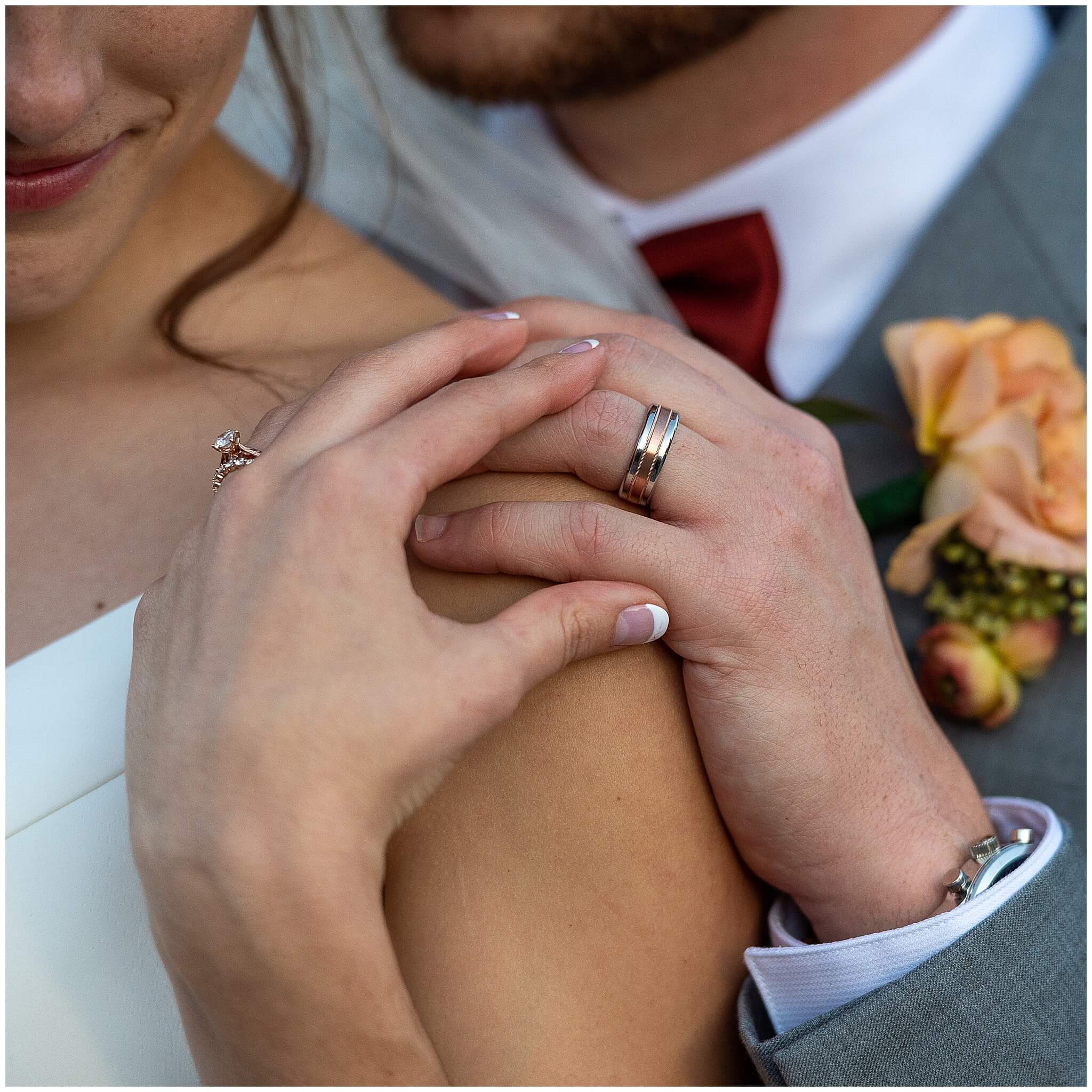 closeup photos of a bride and groom's hands with their wedding bands