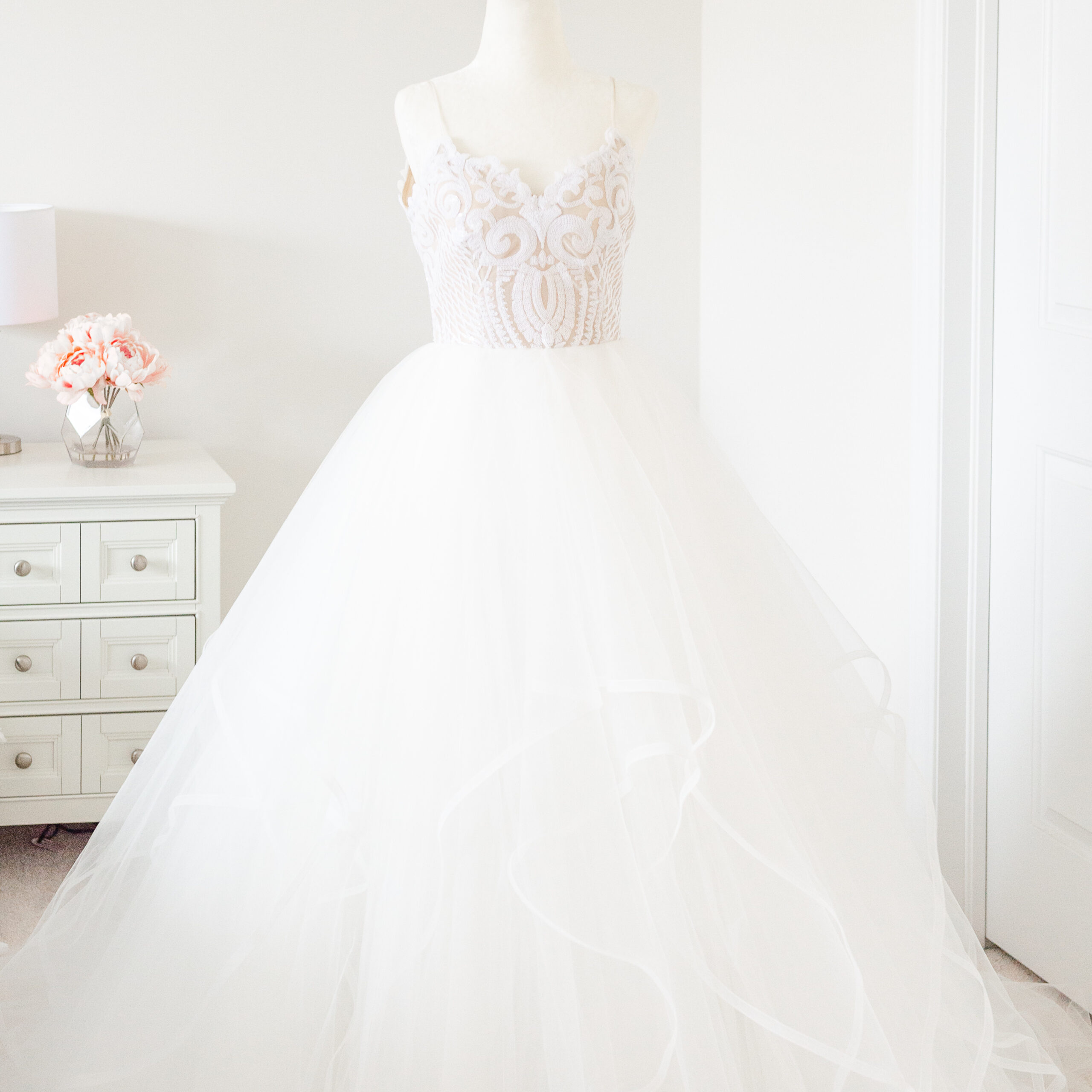Ottawa wedding dress with tulle skirt and spaghetti straps on a mannequin