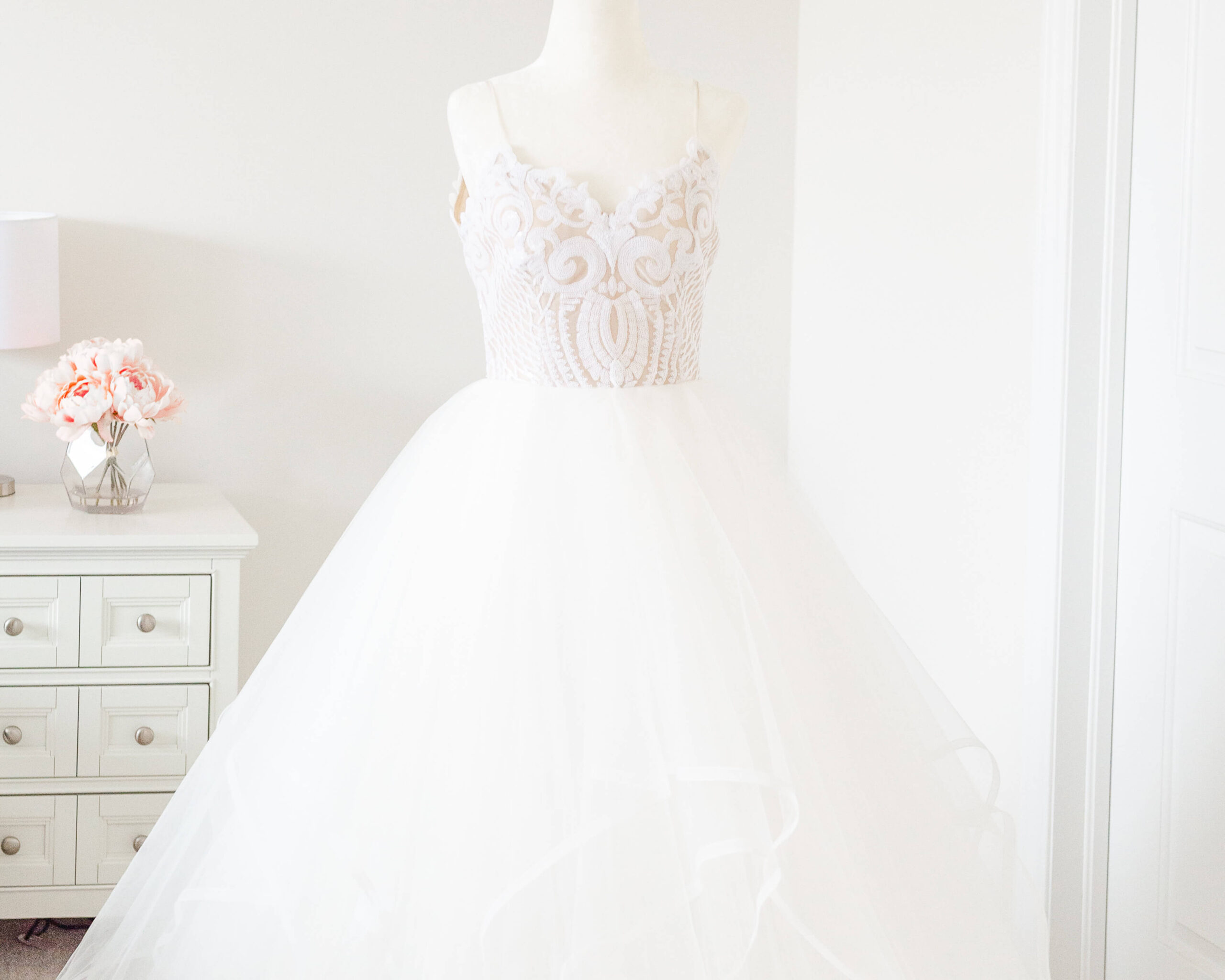 Ottawa wedding dress with tulle skirt and spaghetti straps on a mannequin