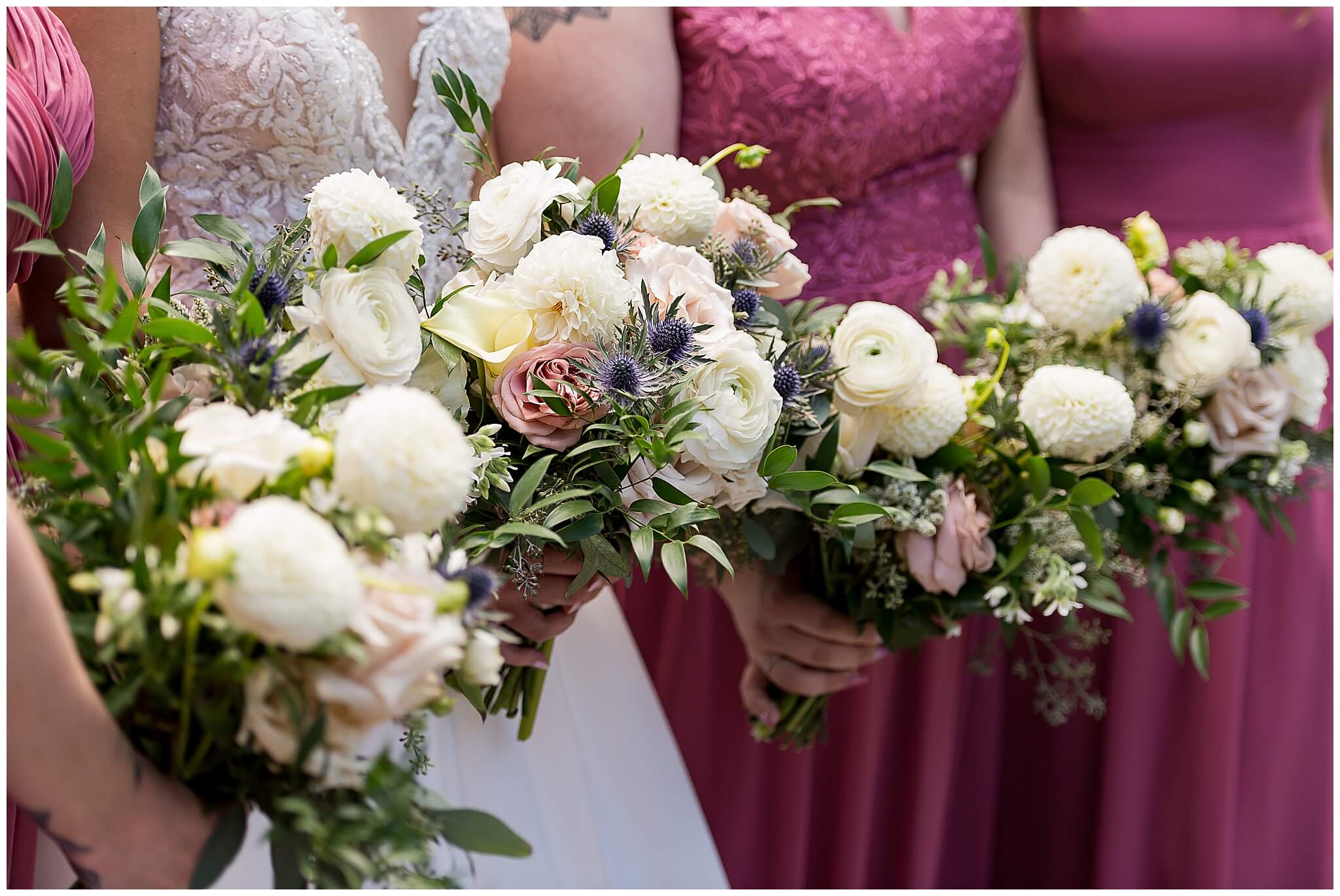 closeup photo of bridesmaids in rose dresses holding bridal bouquets