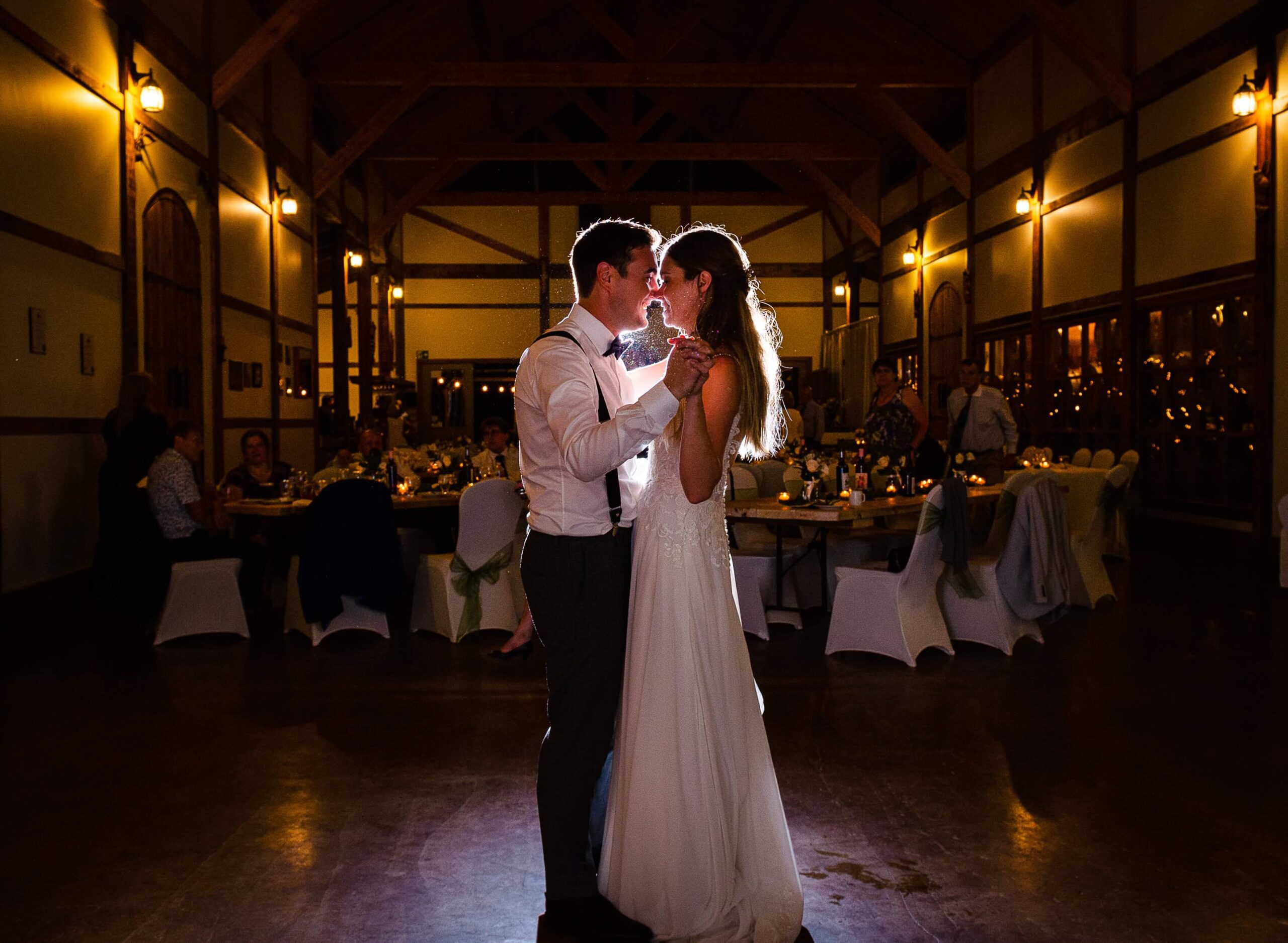 a bride and groom backlit and dancing their first dance at Jabulani Wedding Venue