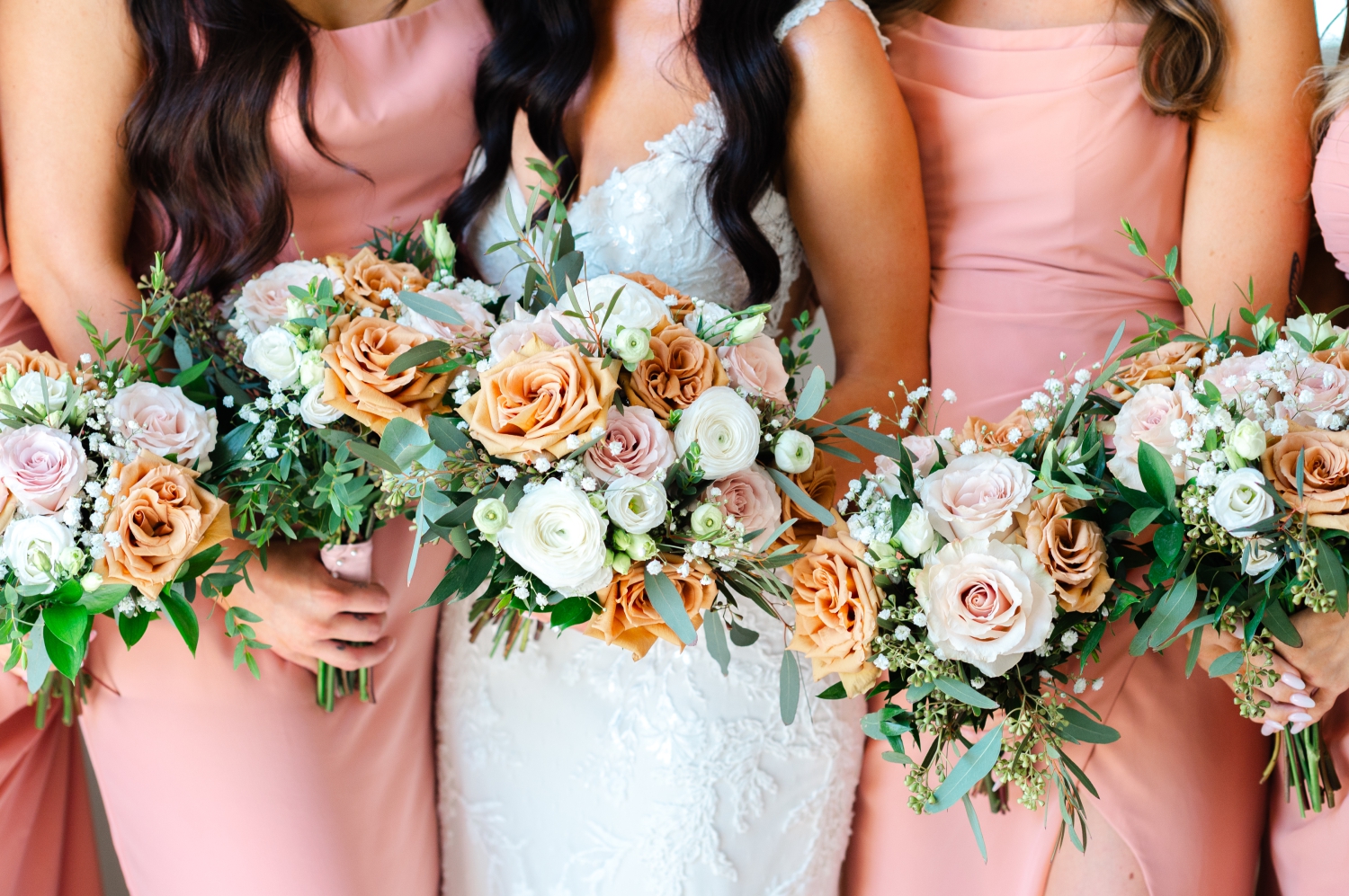 a closeup photo of bouquets in pink, sand and white as part of a Bleeks and Bergamot Wedding