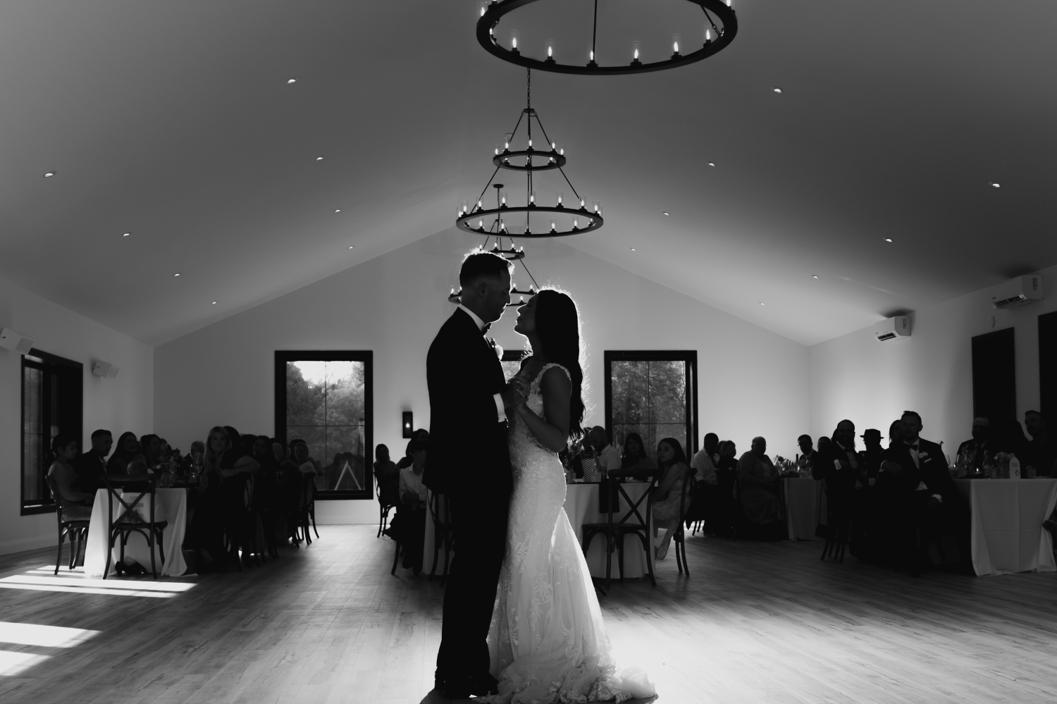 a black and white photo of a bride and groom dancing their first dance at the Bleeks and Bergamot Wedding Venue