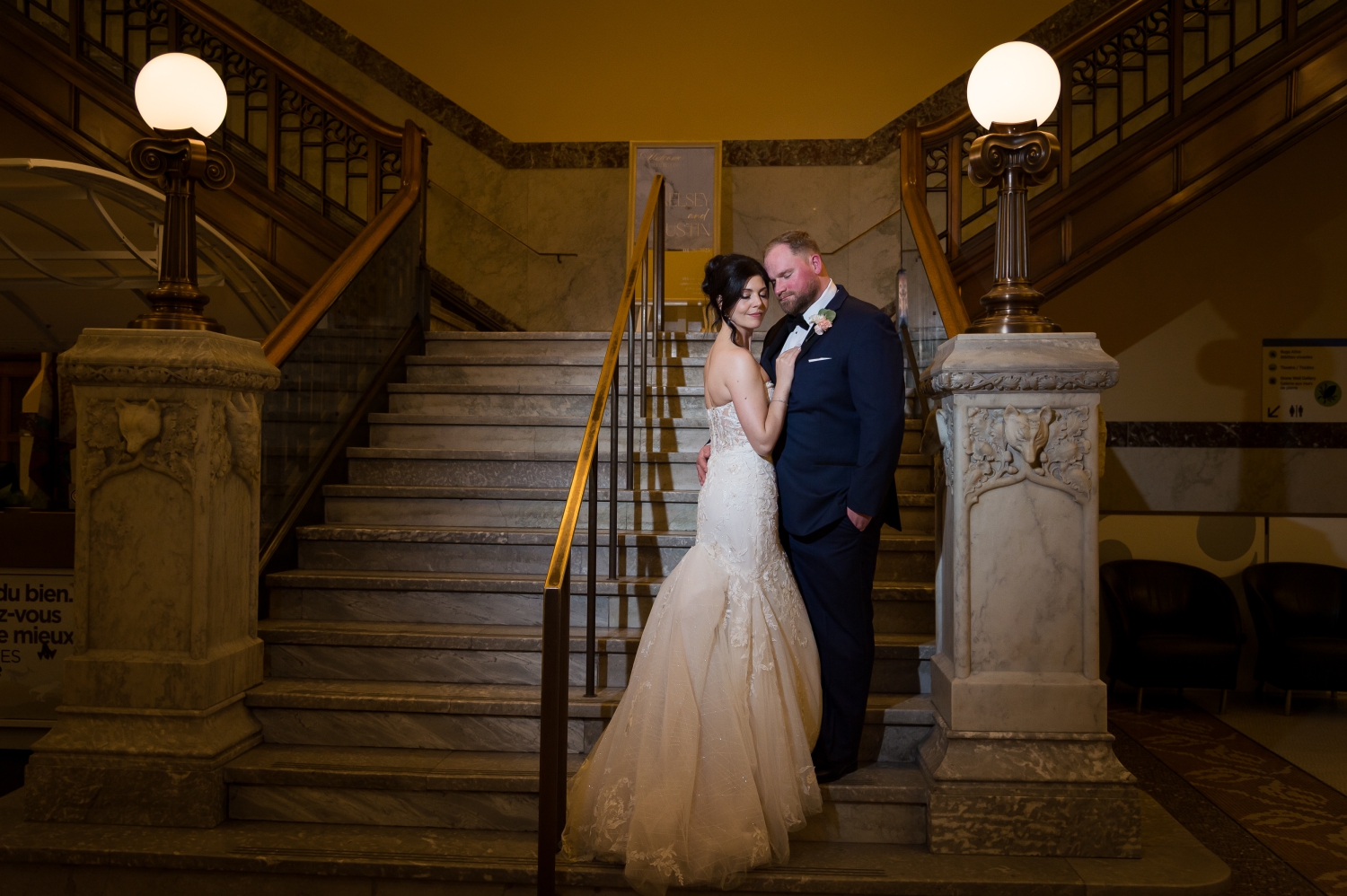 Museum of Nature Wedding Photos showing a dramatic portrait of a bride and groom on the grand staircase of the musuem
