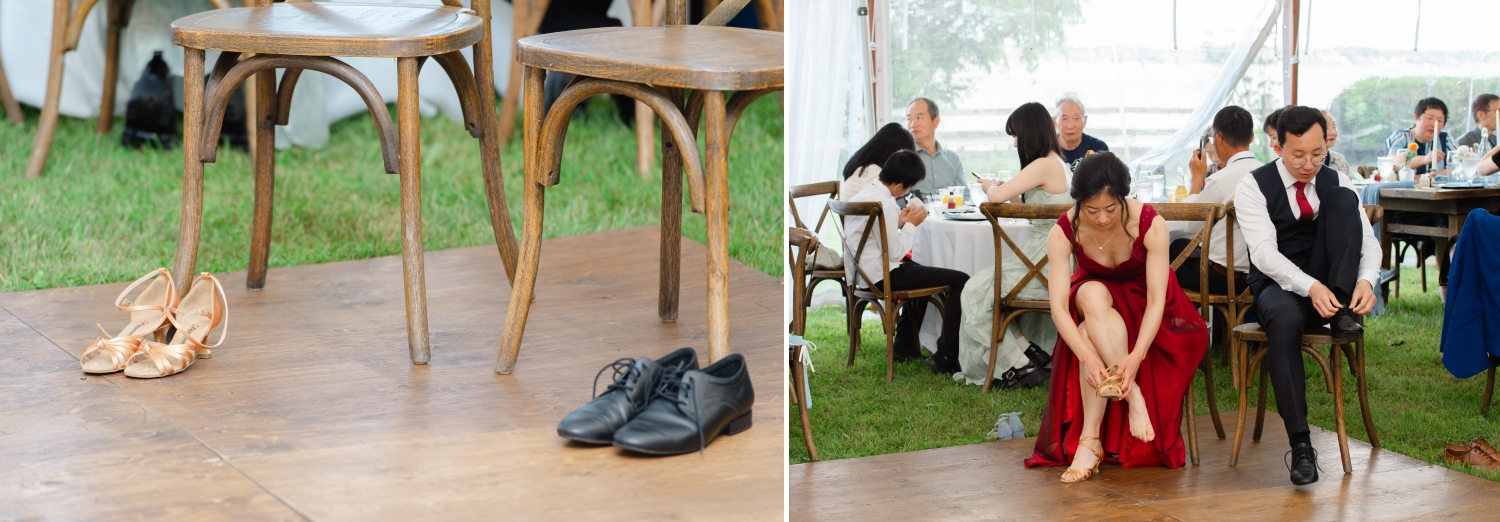 a bride in a red dress and a groom in a black suit and red tie putting on their dance shoes as they prepare for their choreographed first dance