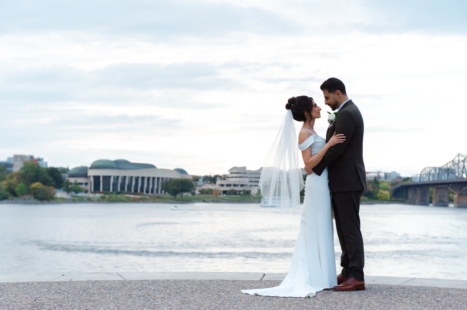 a bride and groom in silhouette with water in the background as part of their Restaurant 18 Weddings experience