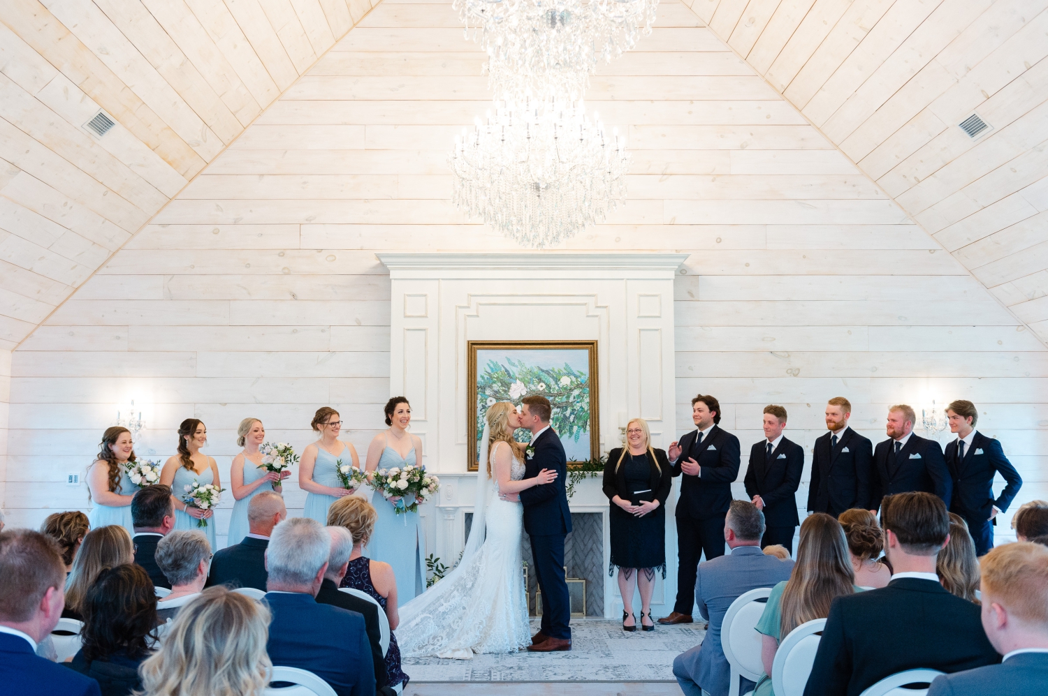a bride and groom kissing at the altar of the Ceremony House at Stonefields Estate. Captured by Ottawa wedding photographer, JEMMAN Photography
