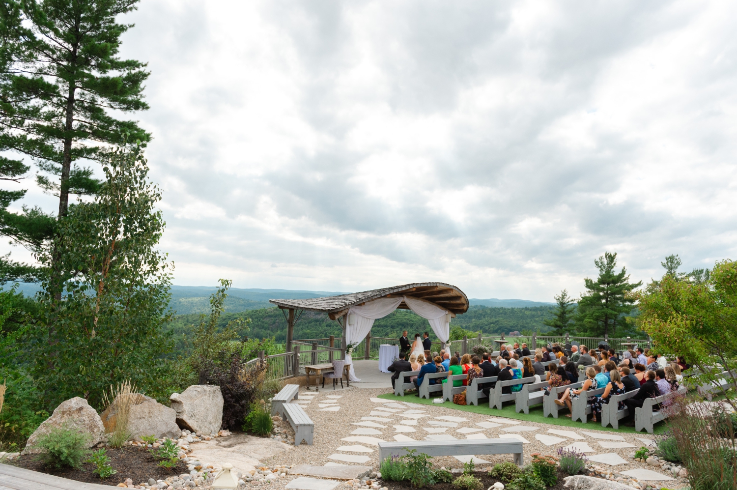 a wide angle photo showing the outdoor ceremony space of the Ottawa outdoor wedding venue, Le Belvedere. Captured by JEMMAN Photography