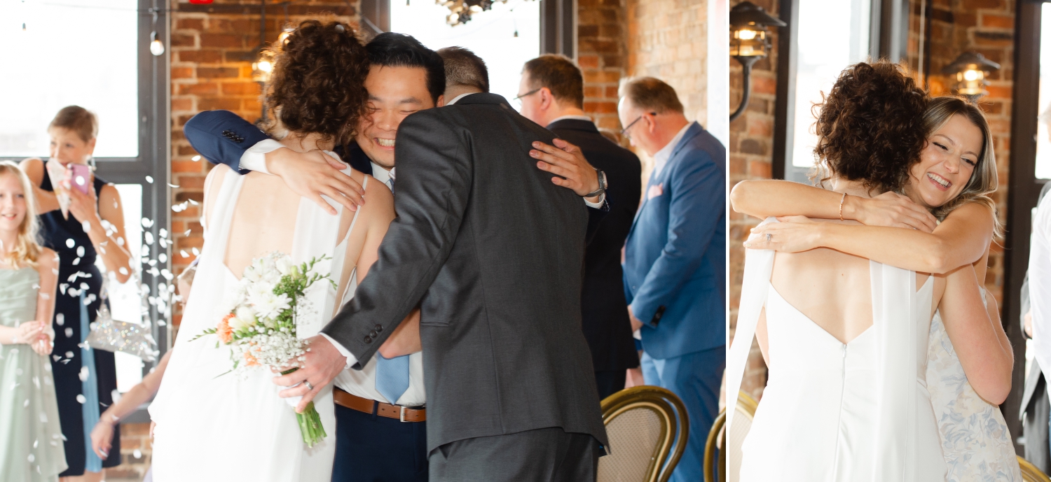 a bride and groom receiving congratulatory hugs from their family and friends after their wedding ceremony at the Starling restaurant in Ottawa. Captured by JEMMAN Photography