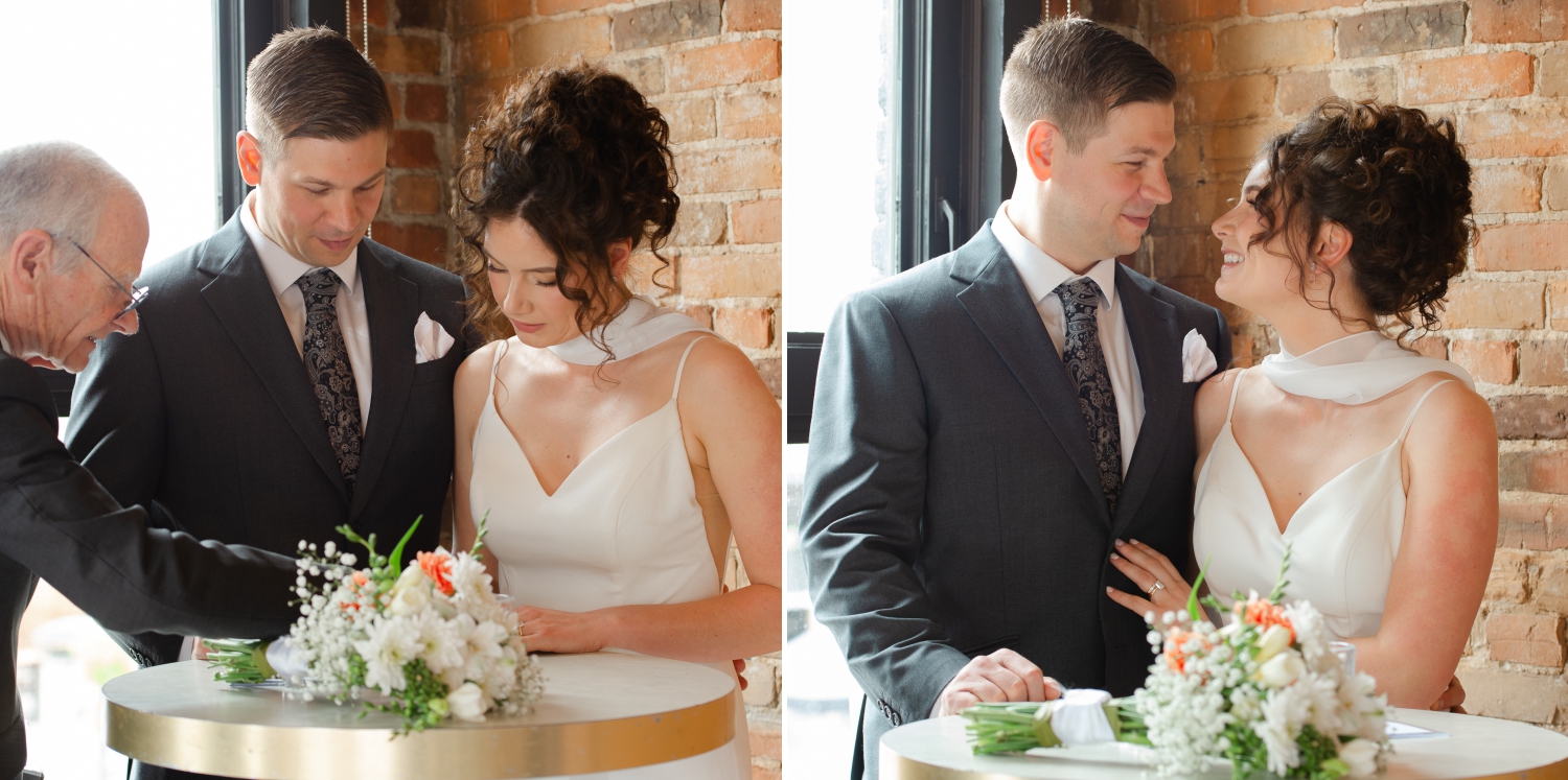 a bride and groom signing their register after their wedding ceremony at the Starling restaurant in Ottawa. Captured by JEMMAN Photography